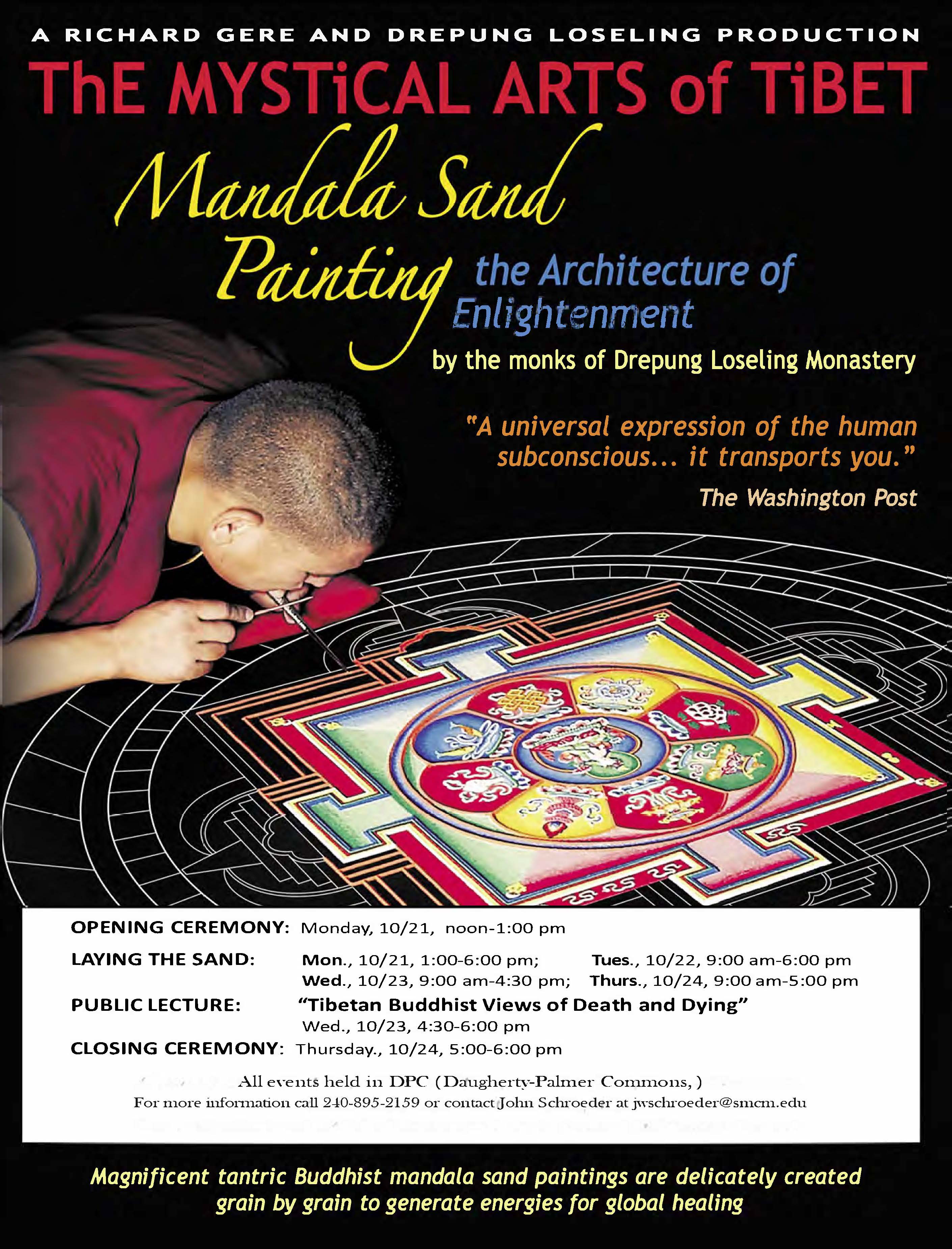 Tibetan monk carefully laying colored sand onto the sand mandala.