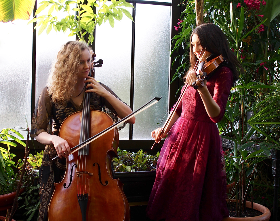 Jocelyn Pettit and Ellen Gira playing fiddle and cello