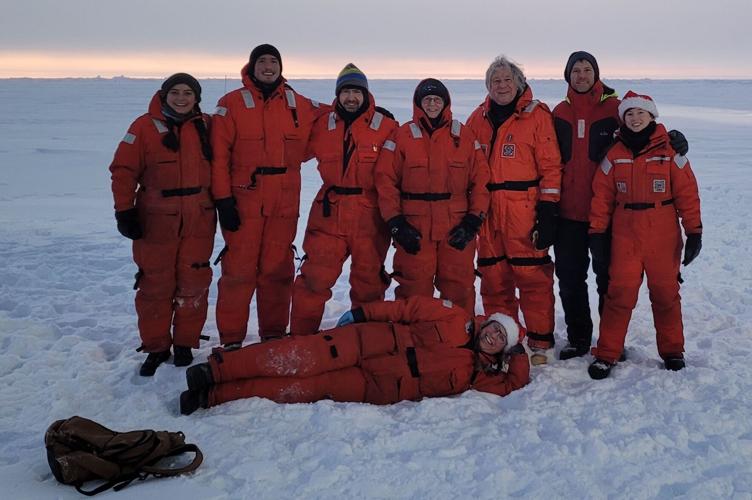 Group of scientists standing on the ice at the North Pole