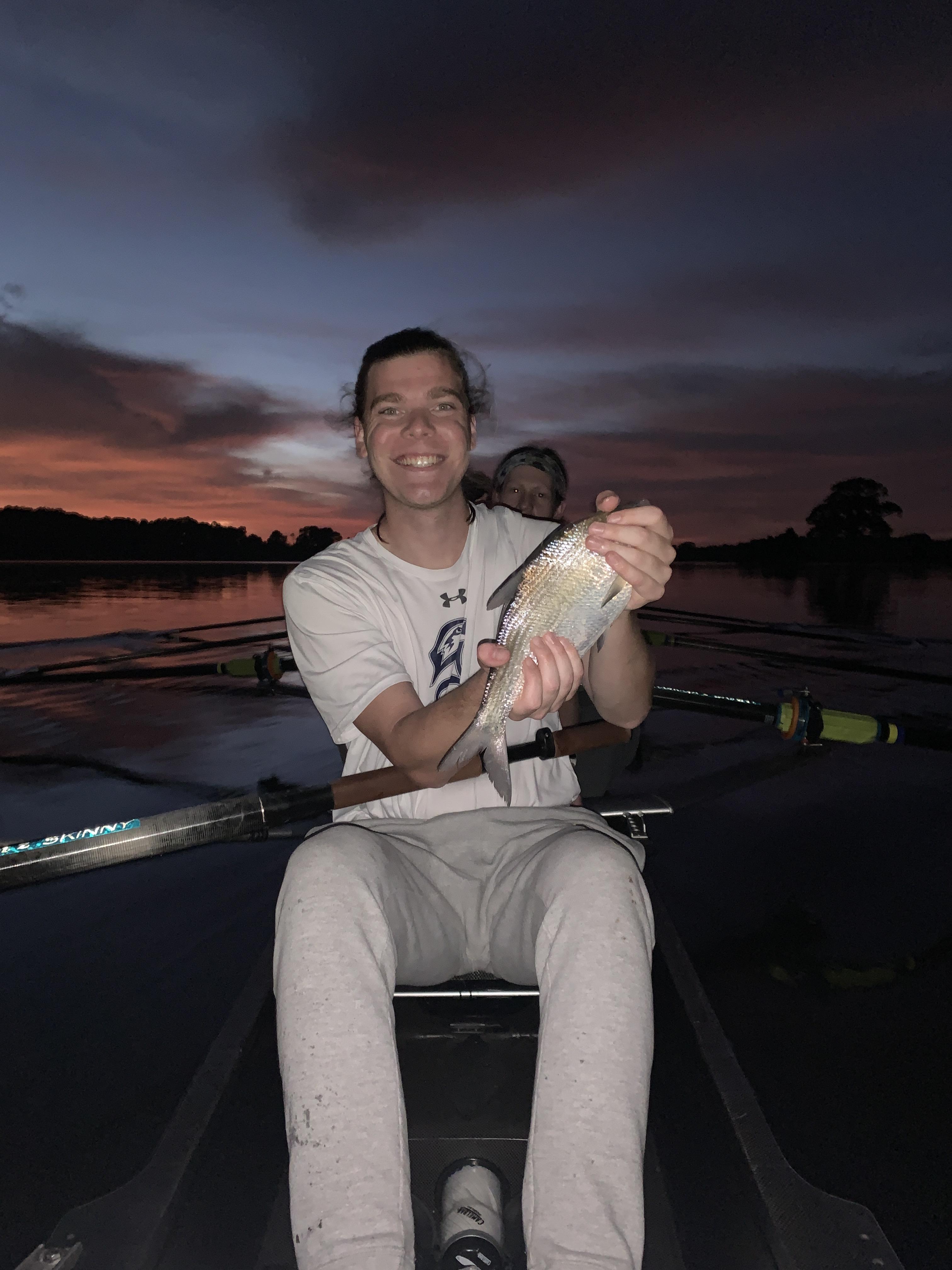 A fish jumped into a rowing boat during practice