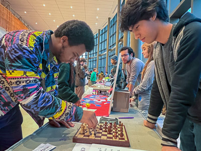 Students Aldous and Ivan play a friendly game of chess 