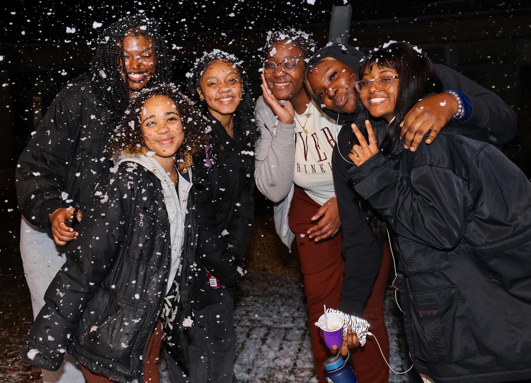 students posing in the snow