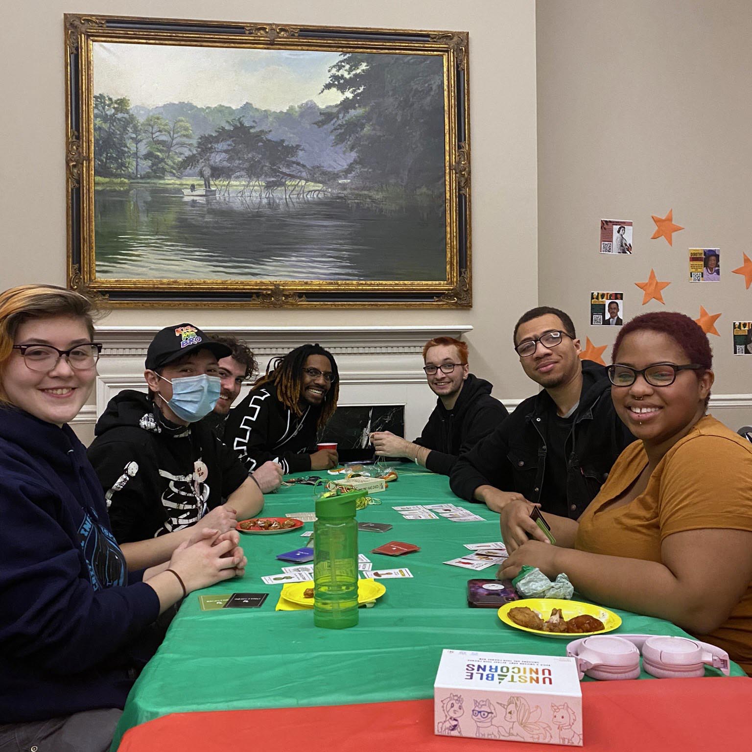 Students sitting at table playing games