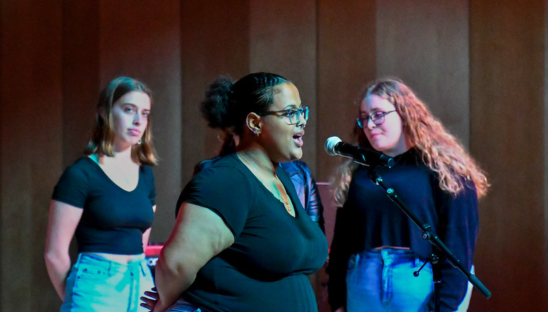 Three students singing