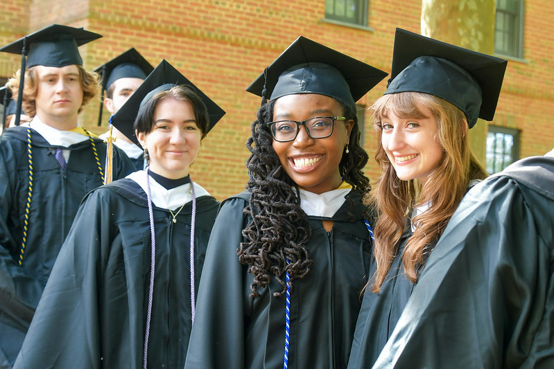 Happy graduates in cap and gown