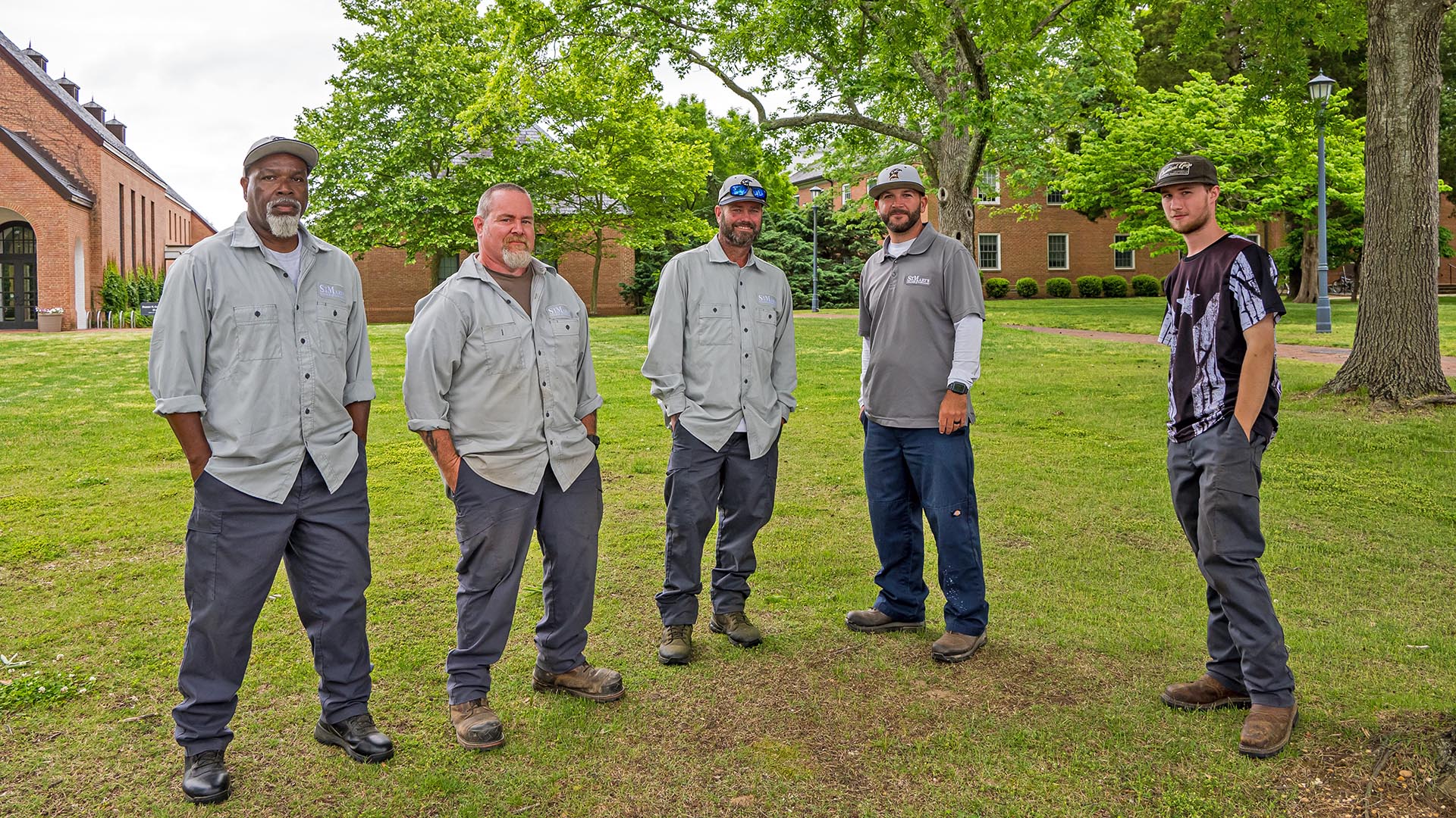 5 physical plant workers stad on the Monty pillow