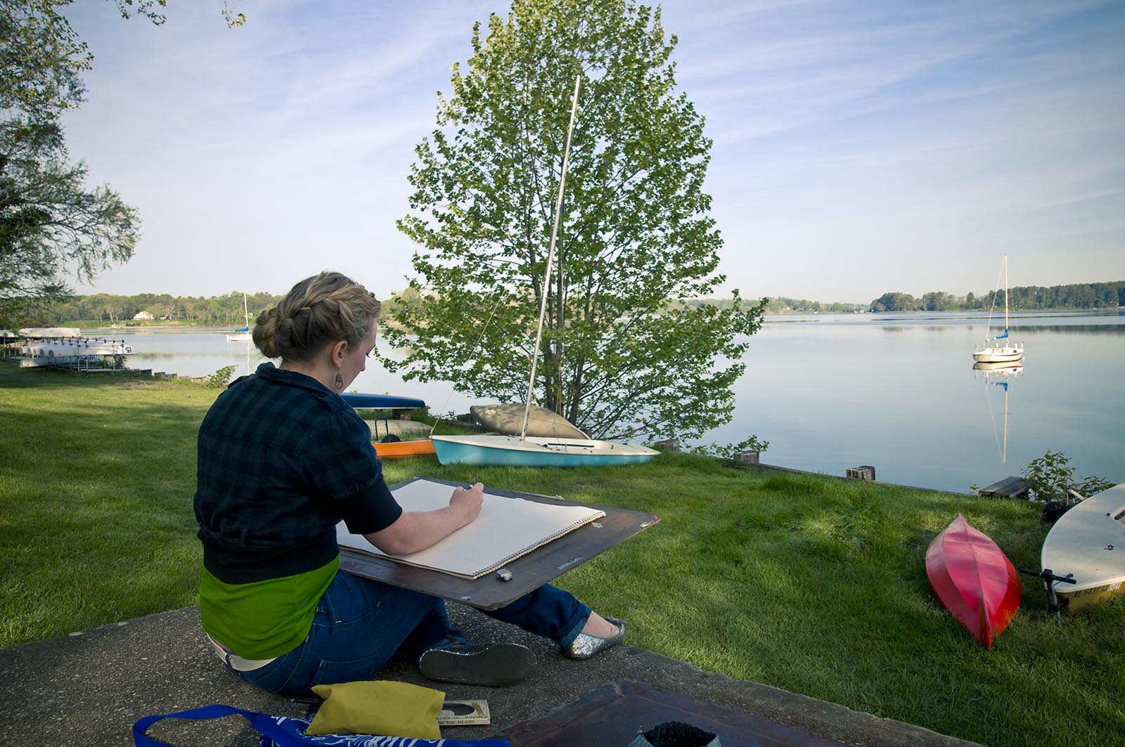 artist with canvas overlooking the St. Mary's River