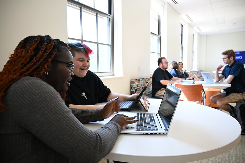 Students around laptop