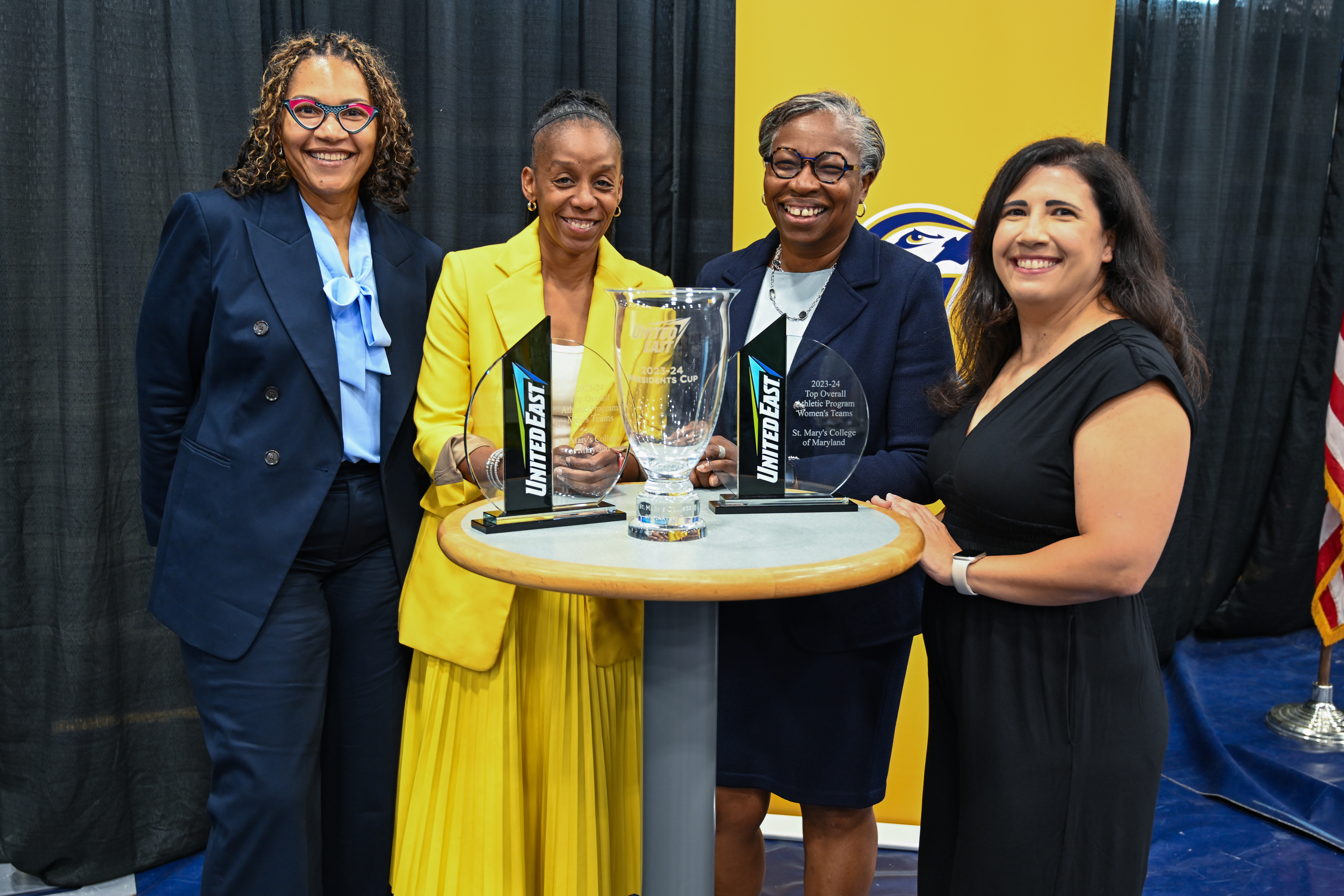  President Tuajuanda Jordan, Crystal Gibson, SMCM athletic director, VP for Student Affairs Jerri Howland and  United East commissioner Stephanie Dutton pose with the Presidents' Cup award