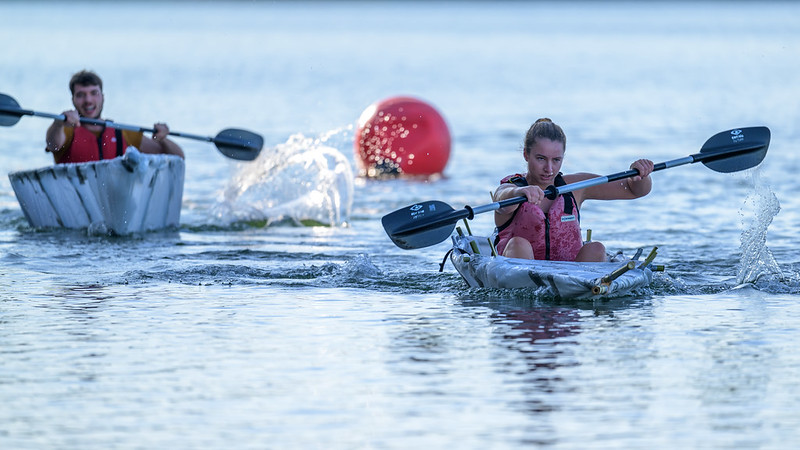 Two competitors race their bamboo boats