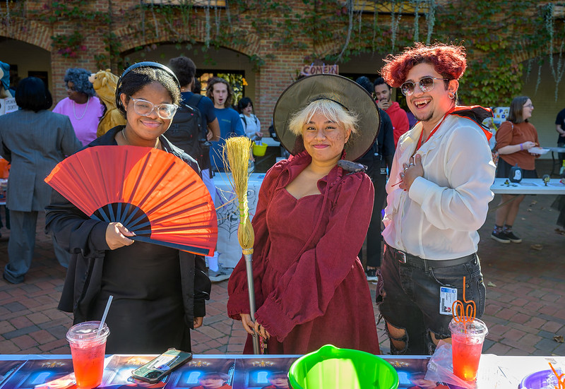 Three students in Halloween costumes