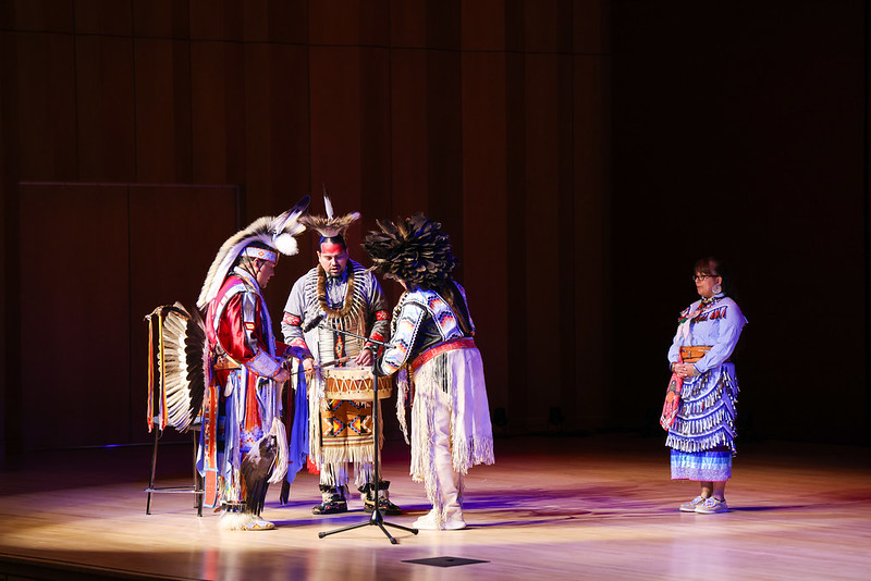 Performers on stage in Native American dress