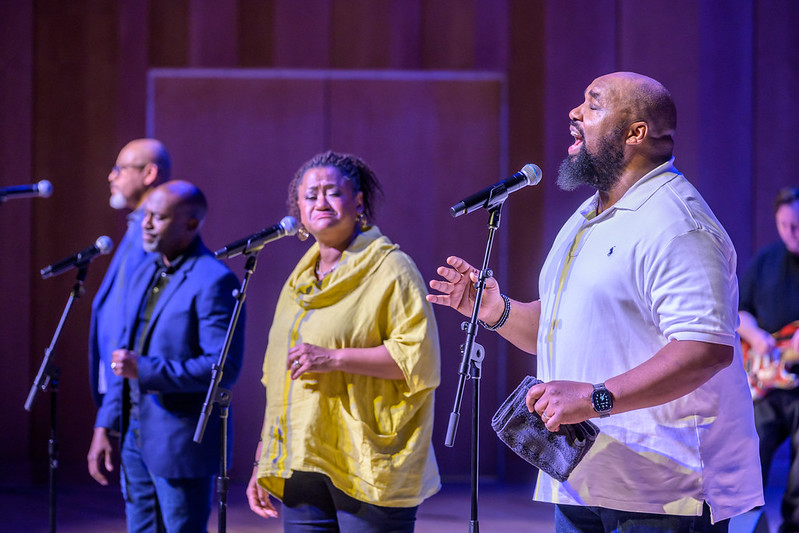 Four singers on stage