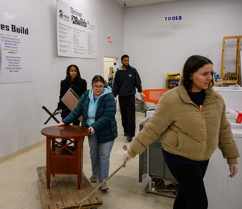 Students moving furniture