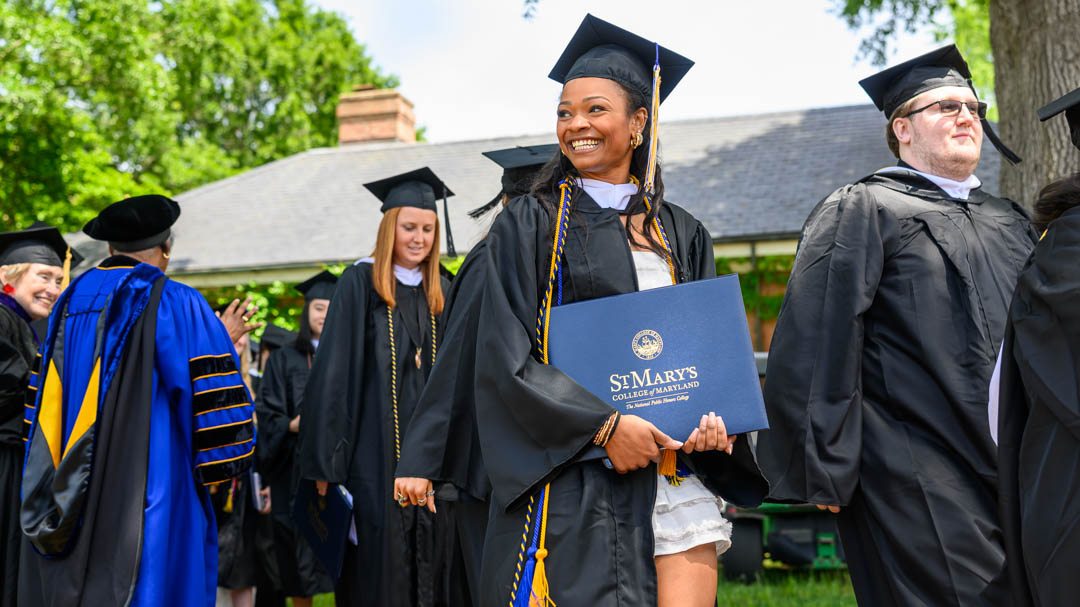 graduates at commencement