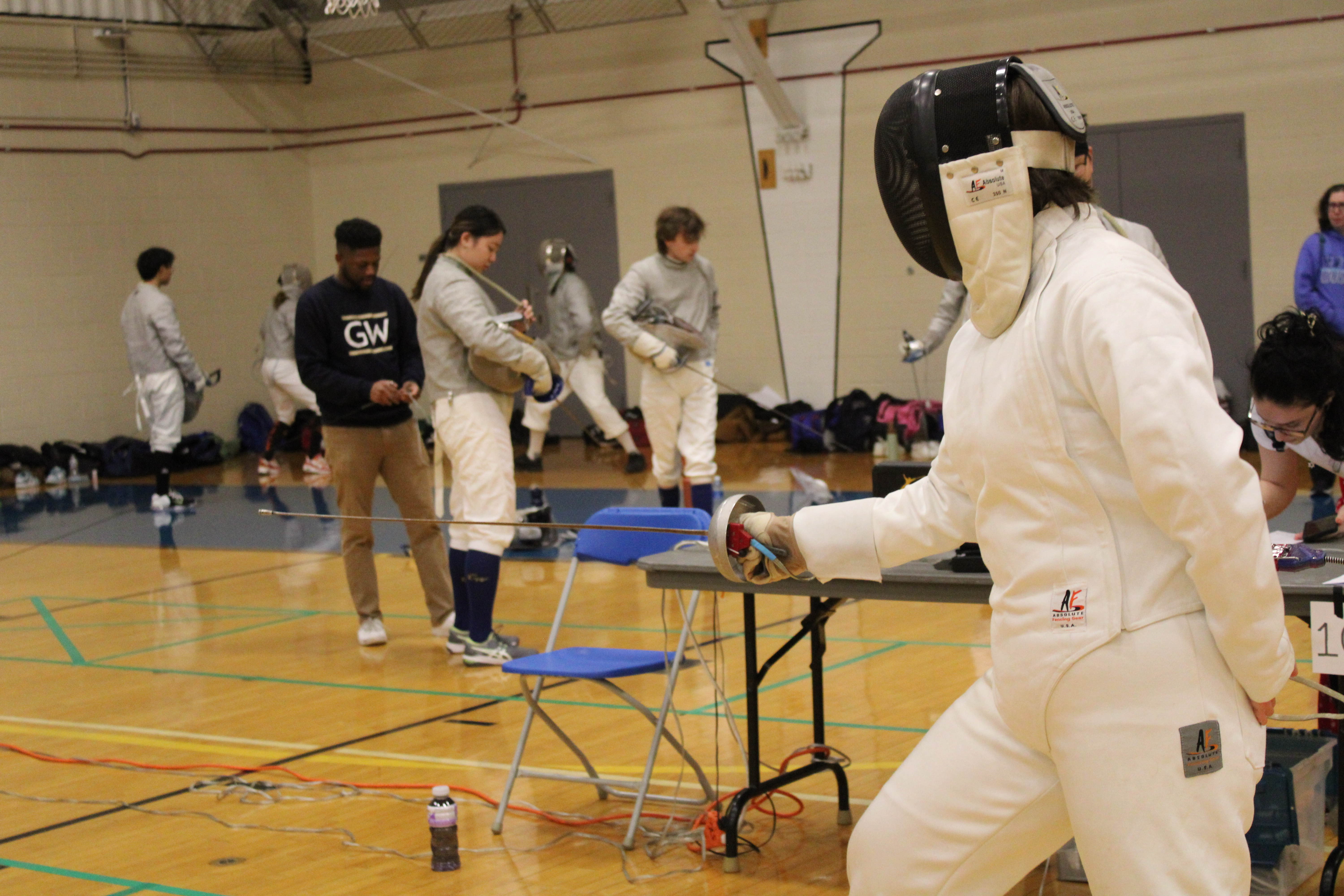 side angle view of a fencer in a fencing position