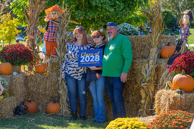 People posing at Hawktoberfest