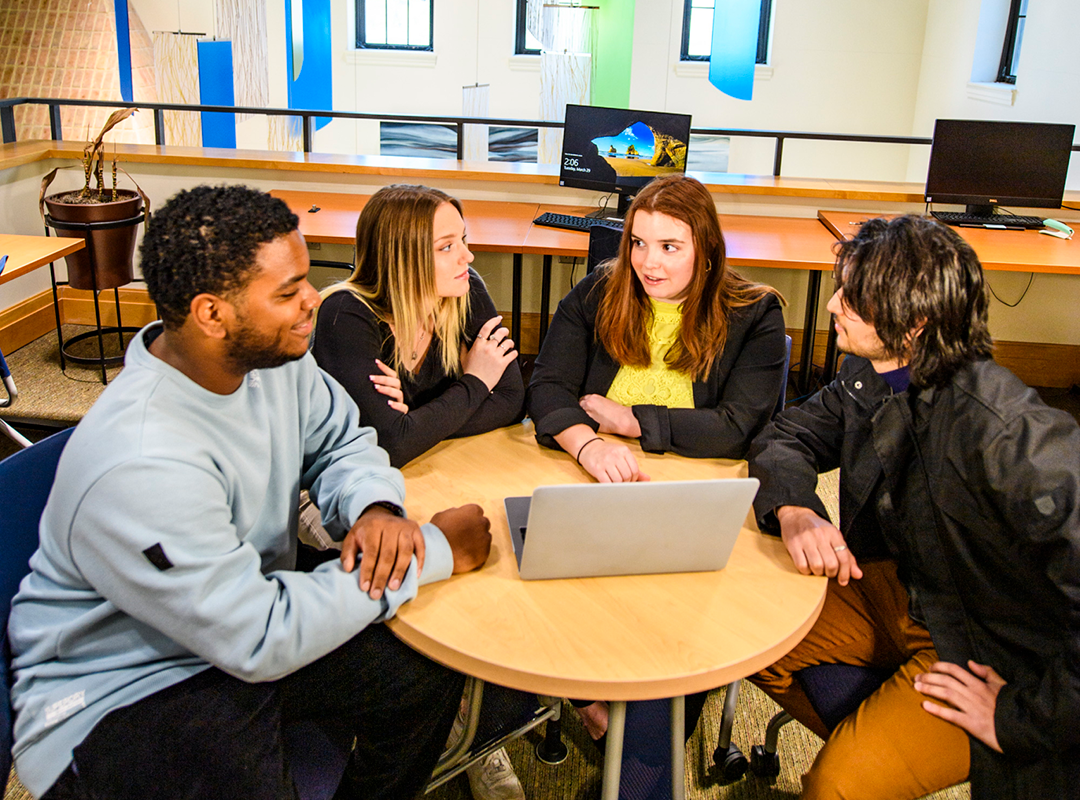 SMCM students sitting in a community space on campus