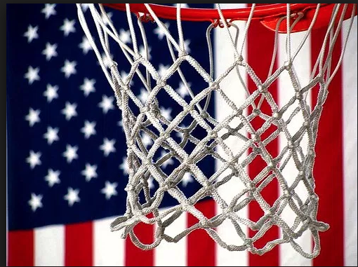 a basketball hoop pictured in front of an American flag