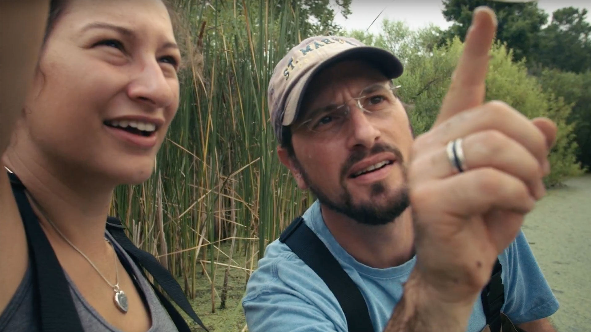 St. Mary's College of Maryland Professor Barry Muchnick and student in the field observing pond water