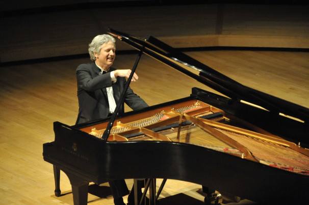 Pianist Brian Ganz performing piano at a recital