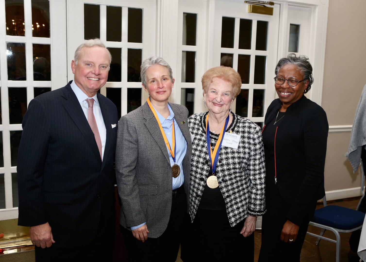 Chairman of the Board of Trustees Sven Holmes, Trish Cole, Loretta “Tiny” Taylor, president of St. Mary’s College of Maryland Tuajuanda C. Jordan. 