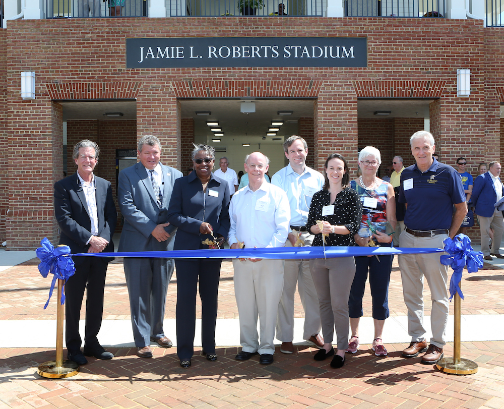 Caption: (L-R) St. Mary’s College Board of Trustees Chair Arthur “Lex” Birney, Maryland State Senator Jack Bailey, St. Mary’s College President Tuajuanda C. Jordan; Jamie L. Roberts father Bob, brother Will, sister Julia, mother Eveline; and St. Mary’s College Director of Athletics & Recreation Scott Devine.