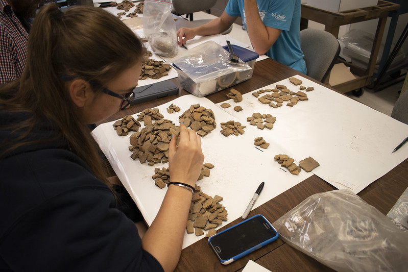 Rachel Bissett catalogs ceramics from a Native American archaeological site