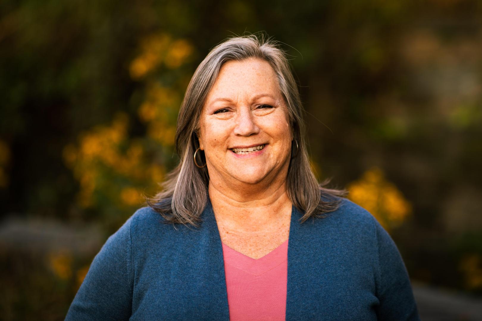 Portrait of Laurie Scherer outside 