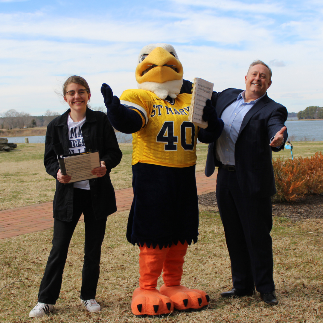 Mary Purtilo, Solomon Seahawk, and David Hautanen pose outside of St. Mary's Hall. 