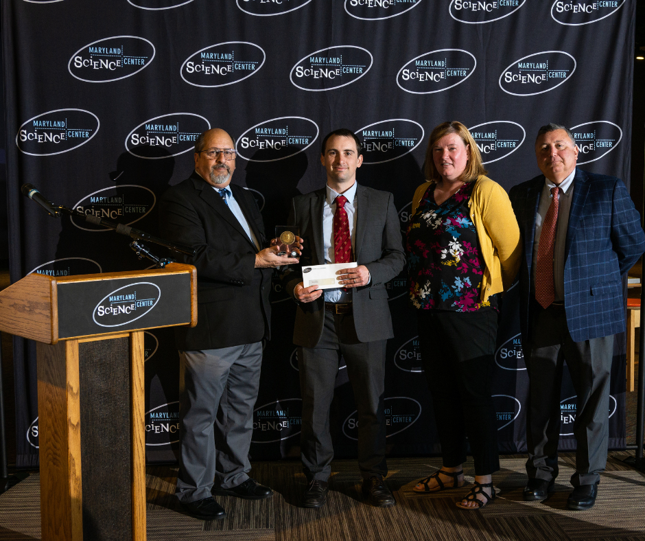 From left, Mark J. Potter: President and CEO of the Maryland Science Center – Dr. Troy Townsend, Outstanding Young Scientist – Mollie Mulherin Thompson: Vice Chair of the Maryland Science Center’s Science and Education Advisory Council