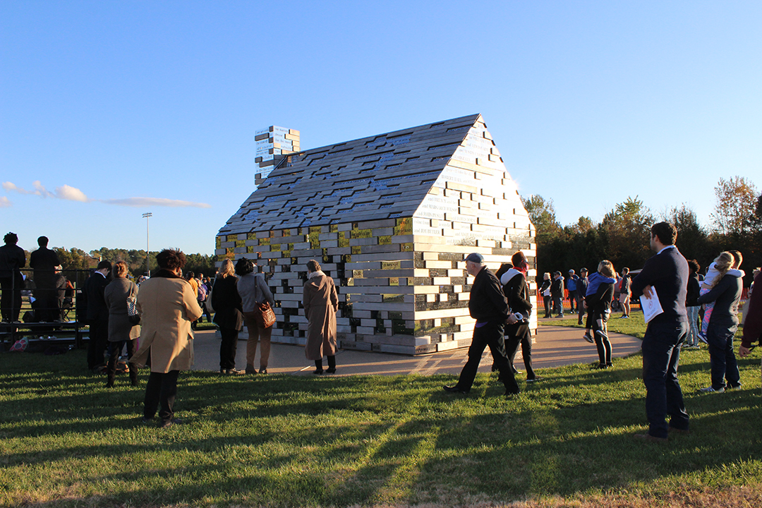 Image of visitors assembled around the Commemorative to Enslaved Peoples of Southern Maryland 