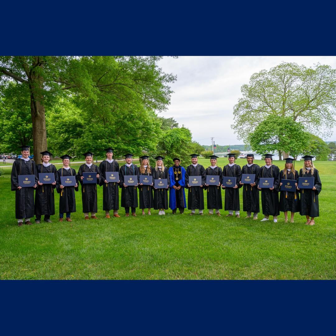 The 15 senior student-athletes from men's and women's lacrosse pose on the College's Townhouse Green in regalia.