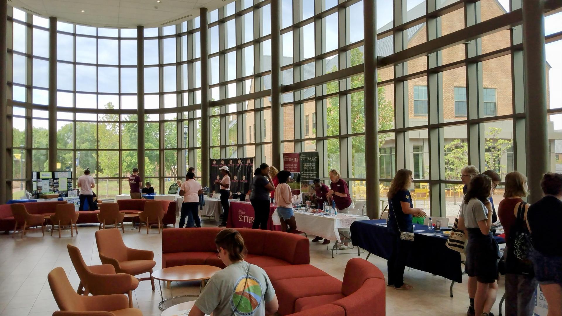 Students visit organization tables during the Volunteerism Day event