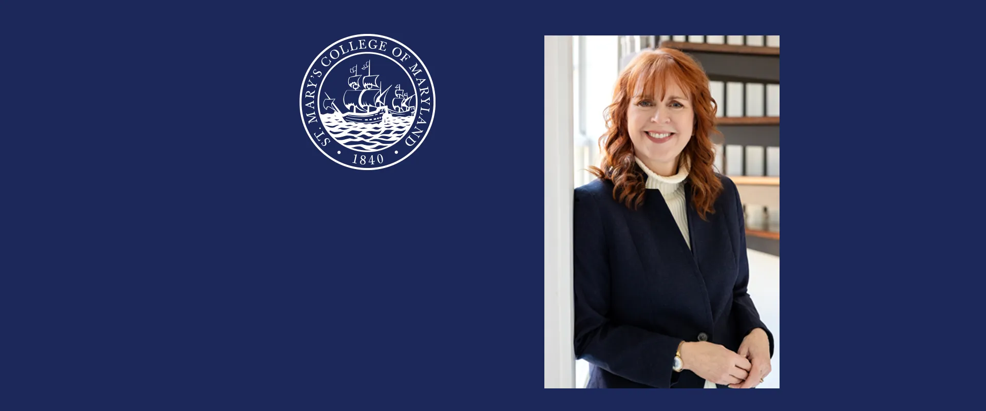 A woman with red hair in a navy blazer stands smiling indoors; to her left is the St. Mary's College of Maryland seal on a blue background.