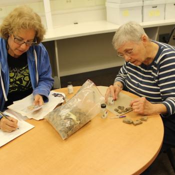 Isabel Tonkavitch and Sara Fisher cleaning and cataloging artifacts in the anthropology lab at St. Mary’s College