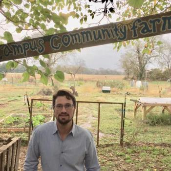 Professor Muchnick at the Kate Chandler Campus Community Farm