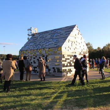 Visitors assembled around the Commemorative to Enslaved Peoples of Southern Maryland 