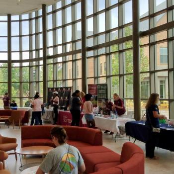 Students visit organization tables during the Volunteerism Day event