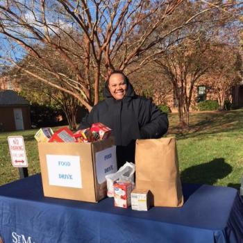 An SMCM staff member collects food donations