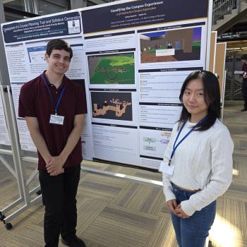 Sophia Lin (COSC 2026) and Joshua D. Swanson (COSC 2026)  stand in front of their poster at the conference.