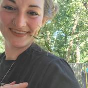 A woman with a Praying Mantis on her shoulder