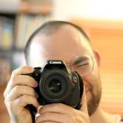 Dan Pindell taking a self portrait in a mirror with a Canon DSLR camera