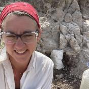 Photo of Dr. Hlubik with a micromorphology sample in the background
