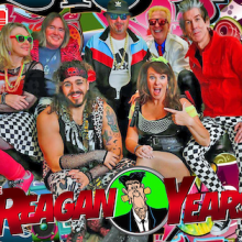 A group of eight adults in colorful, 1980s-themed costumes poses in front of a vibrant, graphic backdrop with "The Reagan Years" text at the bottom.
