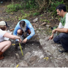 St. Mary’s College students Emily Geckle and Joona Kielek record a building foundation in an excavation as Steve Lenik looks on. (Photo by Steve Lenik)
