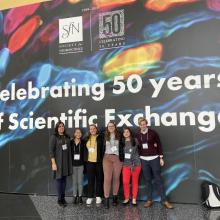 Students gathered in front of Celebrating 50 years of scientific exchange banner