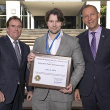 Ethan Elliott '06 receiving NASA medal