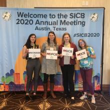 Malisch, center, stands with students Ivy Antunes, Ava Chrisler and Melanie Kimball 