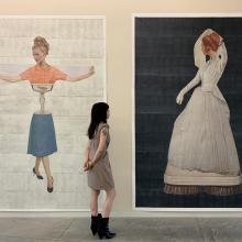 Johnson's Visible Bride art hanging with onlookers. 